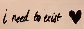 “I need to exist.” handwritten by Yungblud in black on beige paper